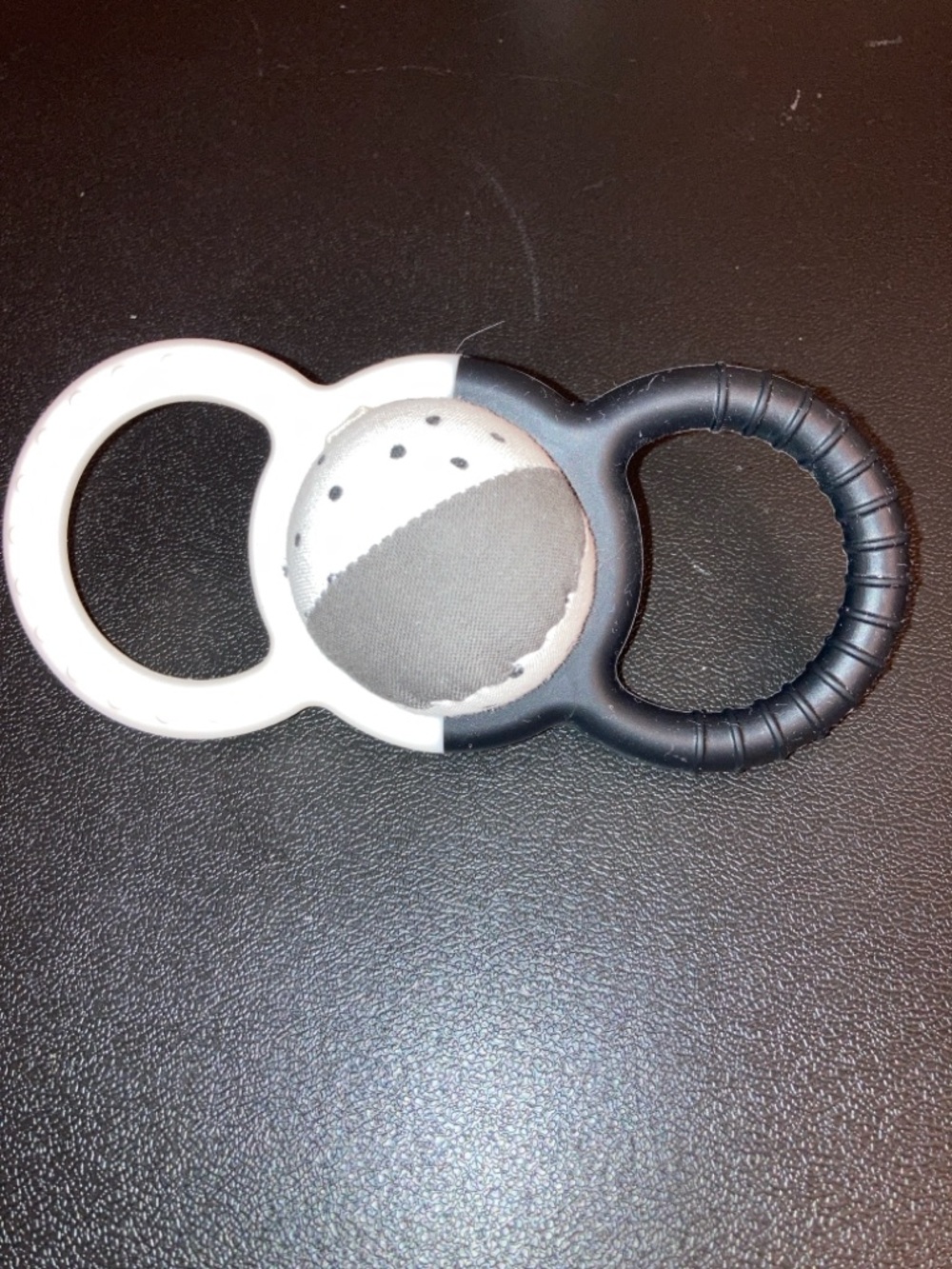 Black and white Lovevery teether rattle